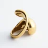 Anello scultoreo a doppia torsione