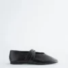 Ballerine in pelle con cinturini incrociati