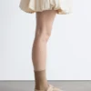 Ballerine in pelle scamosciata con cinturini incrociati