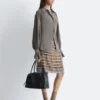 Camicetta con drappeggio e lacci sul retro