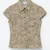 Camicia con lacci sul retro e motivo floreale