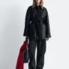 Cappotto in pelle con cintura da annodare