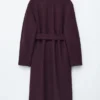 Cappotto voluminoso in lana con cintura