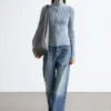 Cardigan con collo alto e zip