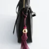 Ciondolo per borsa con nappa in pelle