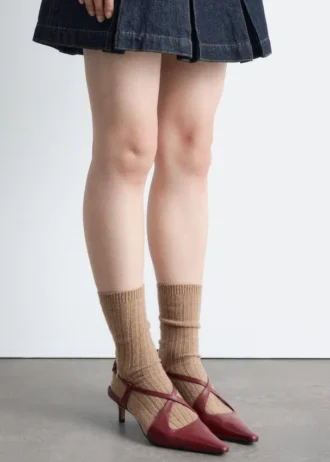 Décolleté con cinturino incrociato in pelle