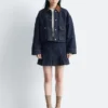 Giacca corta in denim con collo in velluto a coste