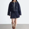 Giacca corta in denim con collo in velluto a coste