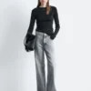 Jeans a gamba larga con borchie
