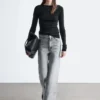 Jeans a gamba larga con borchie