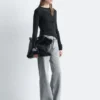 Jeans a gamba larga con borchie