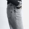 Jeans a gamba larga con borchie