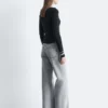 Jeans a gamba larga con borchie