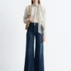 Jeans a zampa con piega a pressione