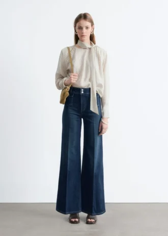 Jeans a zampa con piega a pressione