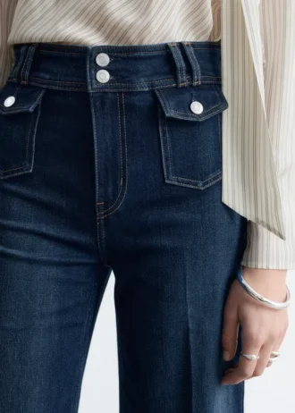 Jeans a zampa con piega a pressione