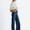 Jeans a zampa con piega a pressione