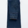 Jeans a zampa con piega a pressione