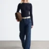Maglia in lana merino con mezza abbottonatura