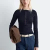 Maglia in lana merino con mezza abbottonatura