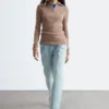 Maglia melange con mezza zip