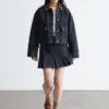 Minigonna in denim plissettato