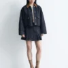 Minigonna in denim plissettato