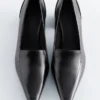 Mocassini con tacco in pelle