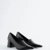 Mocassini con tacco in pelle