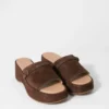 Mules con plateau in pelle scamosciata