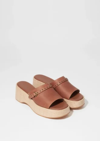 Mules con plateau in pelle scamosciata