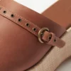 Mules con plateau in pelle scamosciata