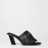 Mules in pelle con frange