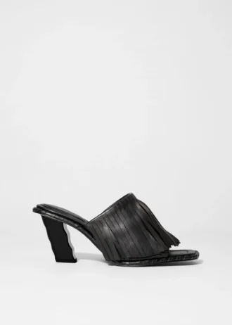 Mules in pelle con frange