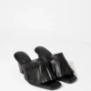 Mules in pelle con frange