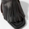 Mules in pelle con frange