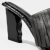 Mules in pelle con frange