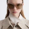 Occhiali da sole con montatura ovale oversize