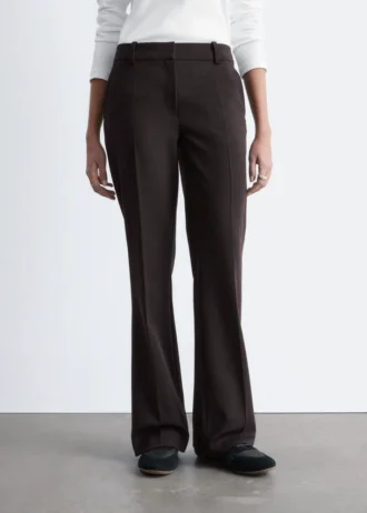 Pantaloni a zampa con piega a pressione