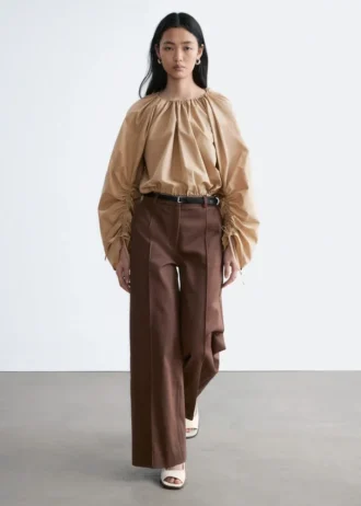 Pantaloni in cotone con piega a pressione