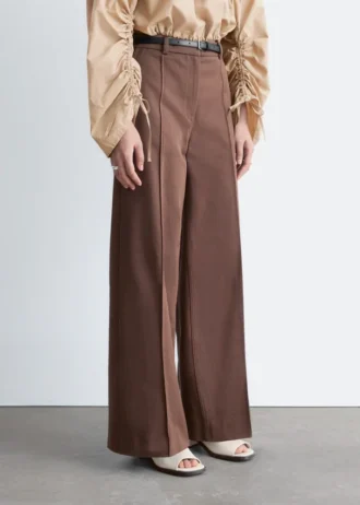 Pantaloni in cotone con piega a pressione