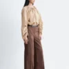 Pantaloni in cotone con piega a pressione