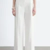 Pantaloni in cotone con piega a pressione