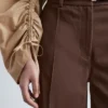 Pantaloni in cotone con piega a pressione