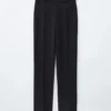 Pantaloni slim con piega a pressione