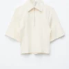 Polo con mezza zip