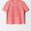 T-shirt con applicazioni floreali