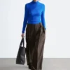 Top a collo alto drappeggiato