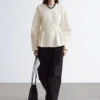 Top in cotone con peplo