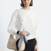 Top in jersey a maniche lunghe